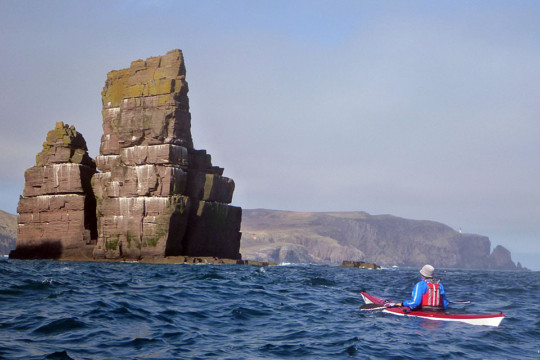 Stack Clo Kearvaig with Cape Wrath Lighthouse in the distance Sea Kayak Stack Clo Kearvaig Cape Wrath