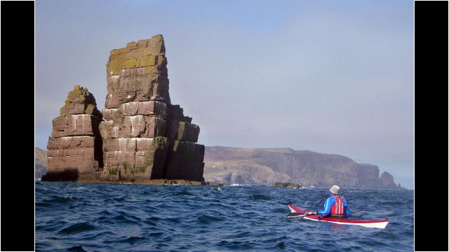 Stack Clo Kearvaig with Cape Wrath Lighthouse in the distance Sea Kayak Stack Clo Kearvaig Cape Wrath