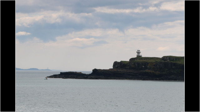 Eilean Chathastail Light & Adnamurchan Point, from Eigg Sea Kayak Eigg Muck Lighthouse