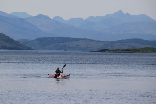 Entering Loch Duich, Cuillins of Skye behind Sea Kayak Loch Duich Eilean Donan Castle