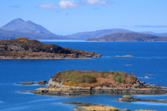 Plockton Islands, Skye behind Sea Kayak Plockton