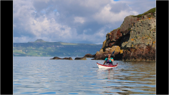 Crowlin Island Cliffs, Raasay behind Sea Kayak Crowlin Islands