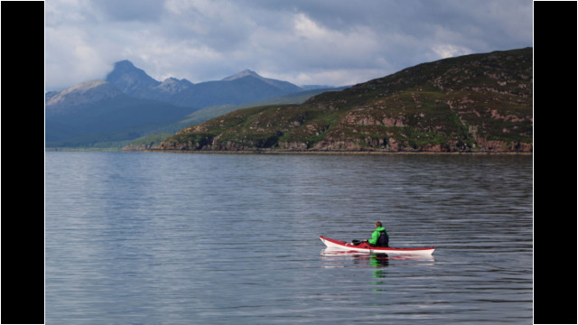 Looking across to Crowlin Islands, Skye behind Sea Kayak Crowlin Islands