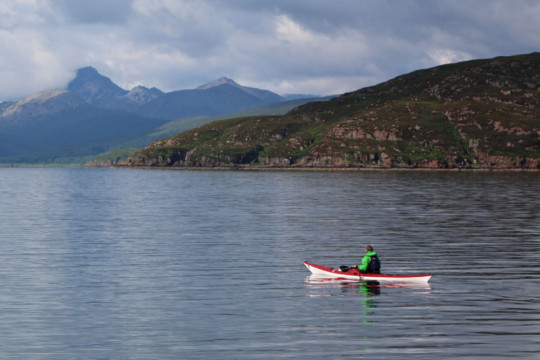 Looking across to Crowlin Islands, Skye behind Sea Kayak Crowlin Islands