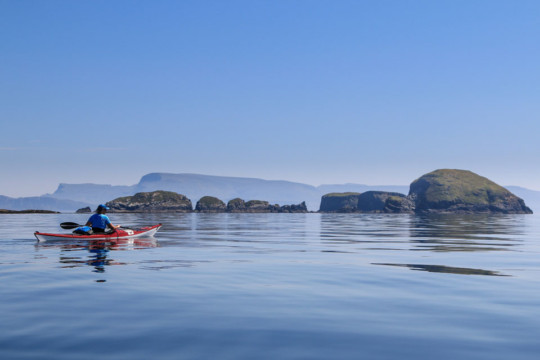 Lord Macdonald's Table, Gaeilavore Island, Skye behind Sea Kayak Fladda-chuain Skye