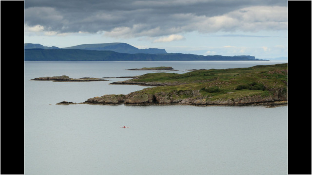 Eilean Fladday, Skye behind Sea Kayak Raasay Rona