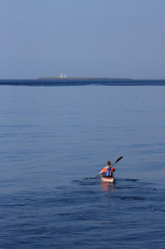Heading out to Pentland Skerries Sea Kayak Pentland Skerries Lighthouse