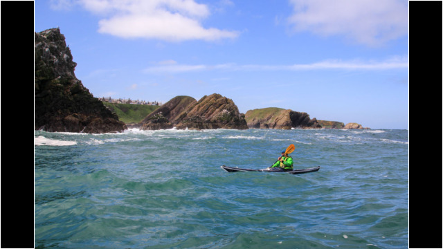 Leaving Portknockie Sea Kayak Bow Fiddle Rock