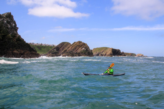 Leaving Portknockie Sea Kayak Bow Fiddle Rock